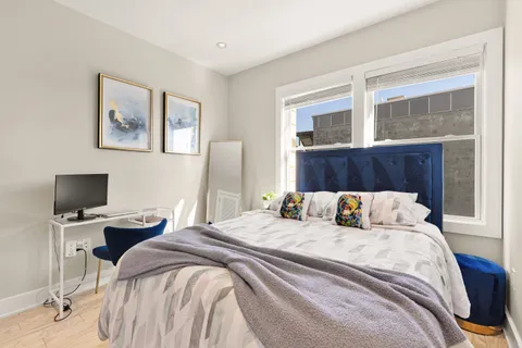 a bathroom with a sink mirror and a shower