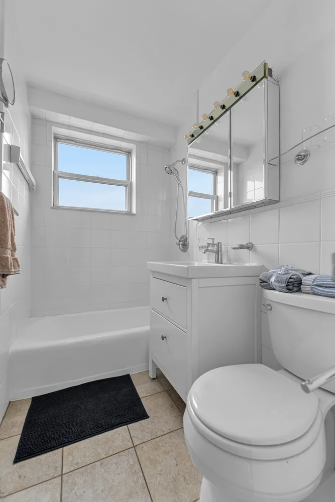 a bathroom with a sink a toilet and bathtub