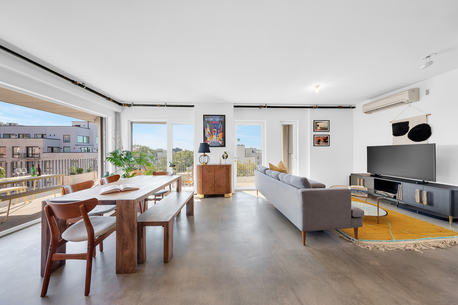 651 New York Avenue, Unit 604 Brooklyn, NY 11203 - Photo 1 of 13 a living room with furniture and a flat screen tv