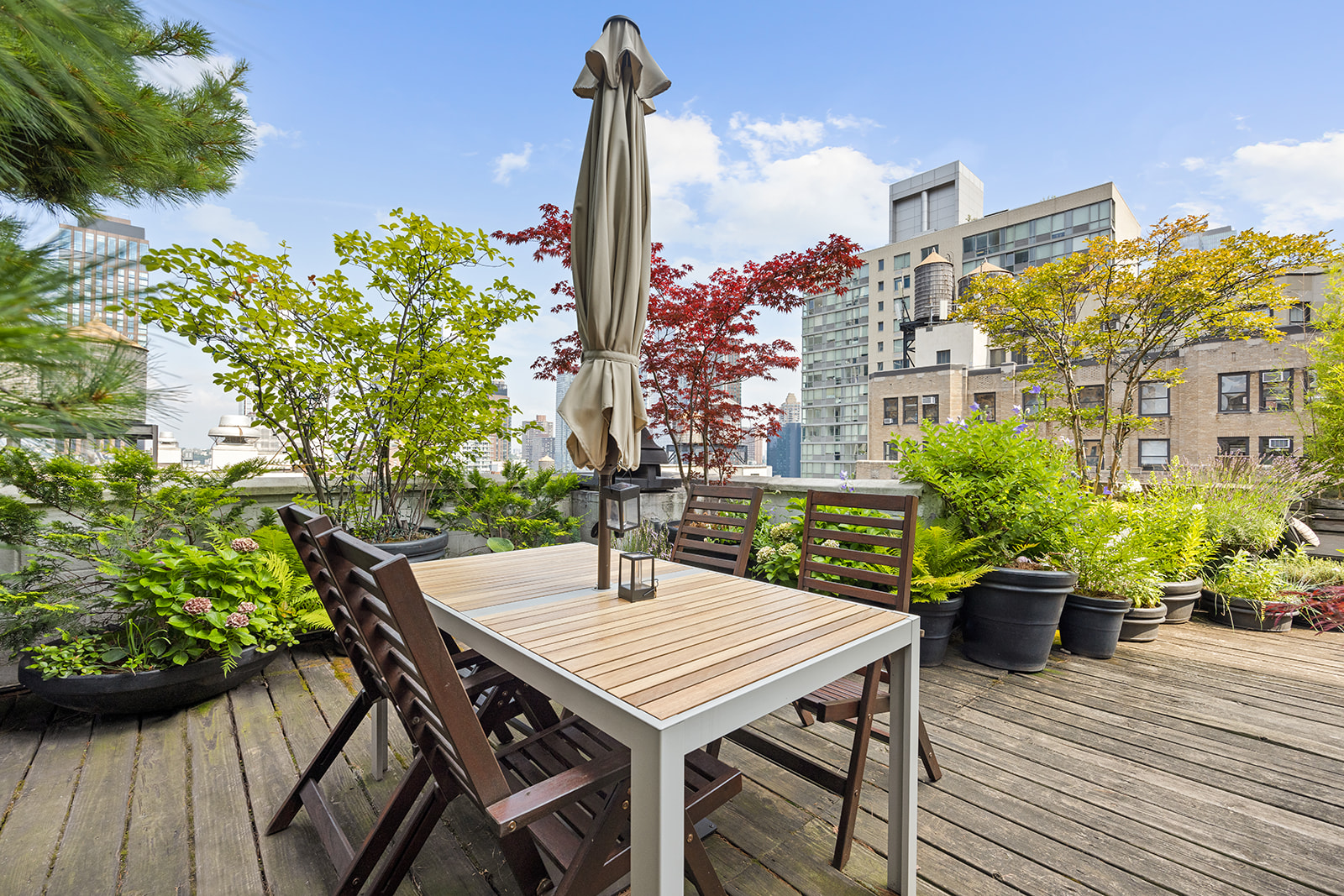 348 West 36th Street, Unit 6N Manhattan, NY 10018 - Photo 10 of 12 a view of a balcony with furniture
