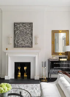 a view of a livingroom with furniture and a fireplace