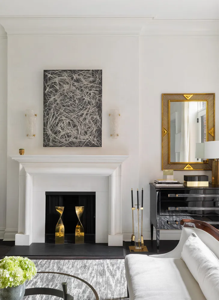 a view of a livingroom with furniture and a fireplace