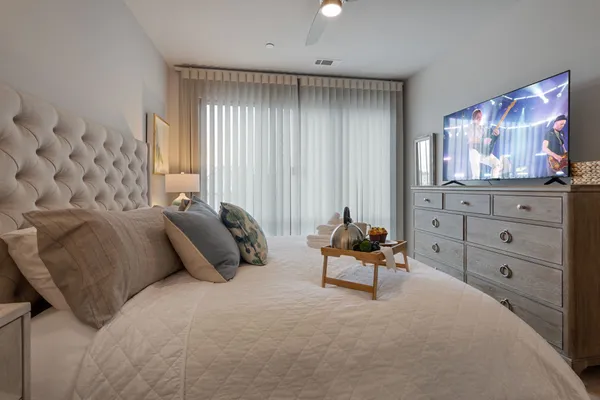 a bedroom with a bed and window