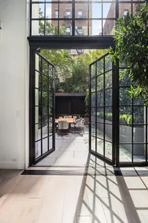 a view of a living room and floor to ceiling window