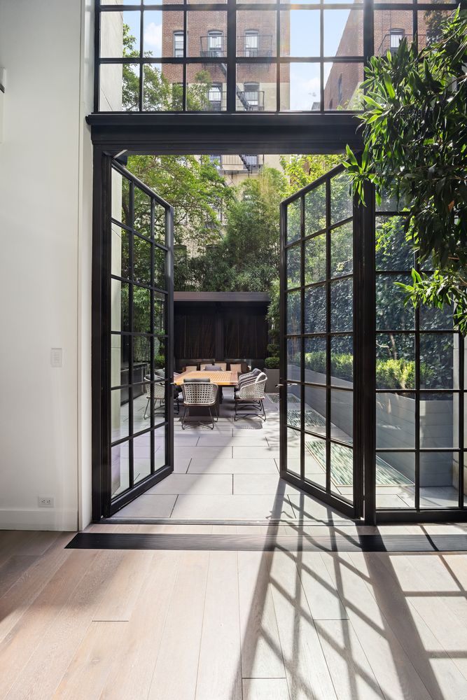 a view of a living room and floor to ceiling window