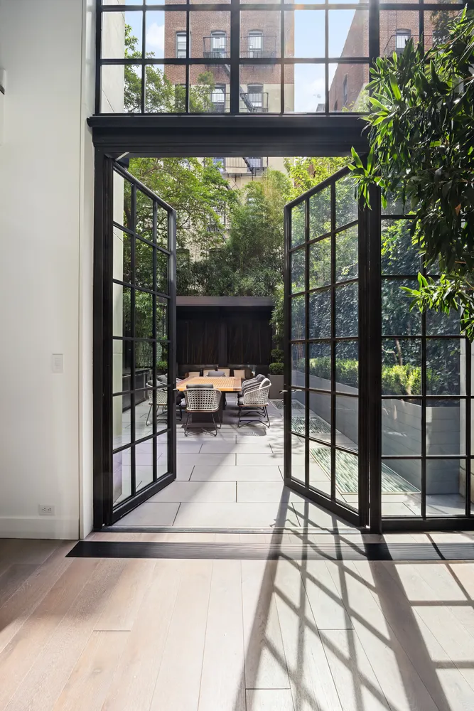 a view of a living room and floor to ceiling window