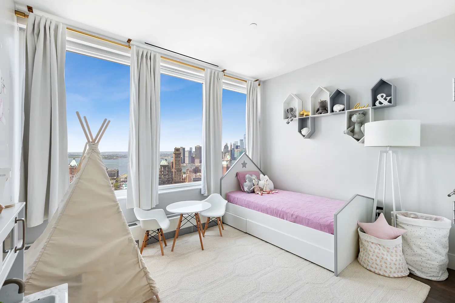 a bedroom with furniture and a potted plant