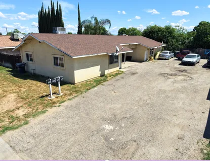 a aerial view of a house with table and chairs