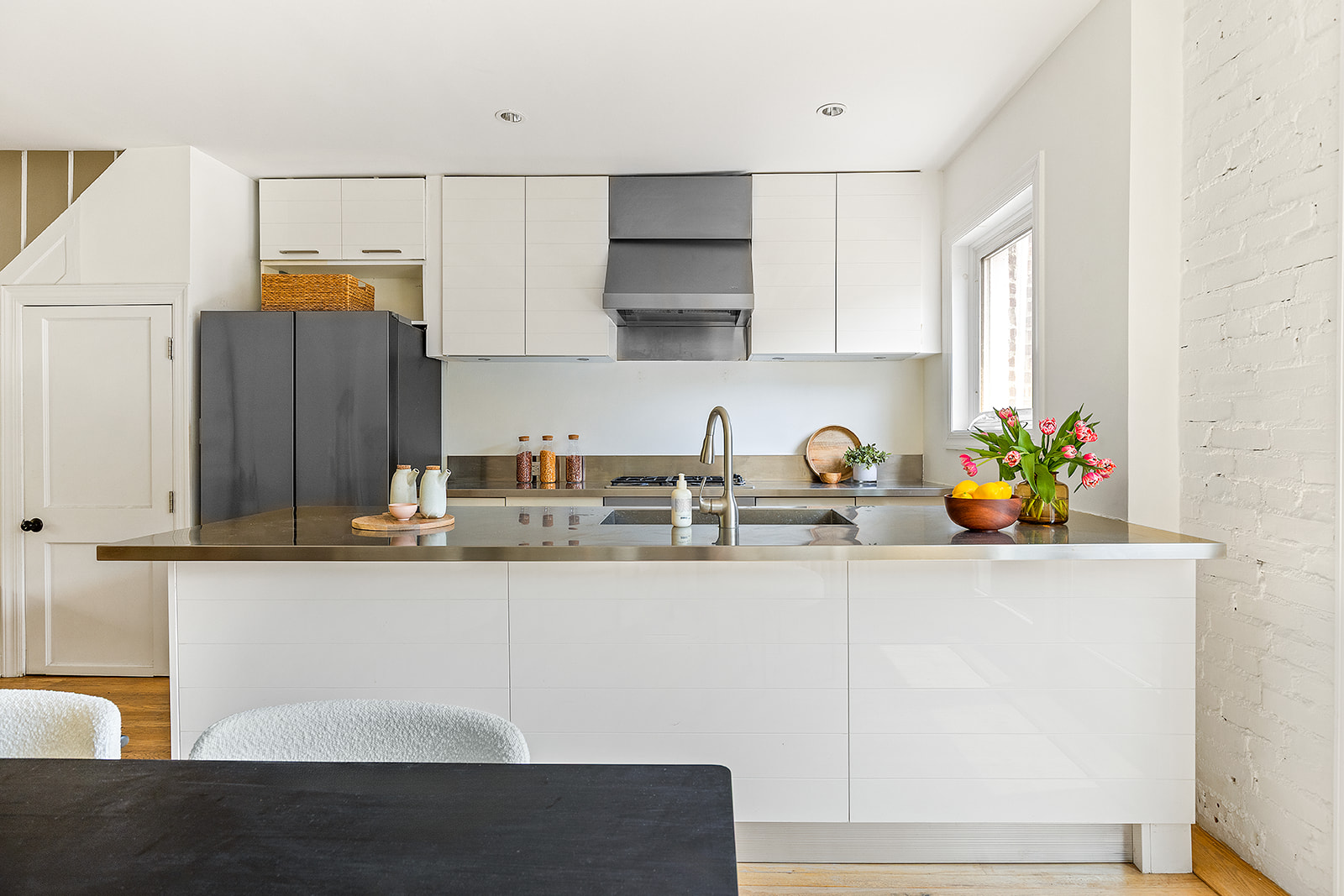 22 Sharon Street Brooklyn, NY 11211 - Photo 3 of 10 a kitchen with stainless steel appliances a sink a refrigerator and a stove
