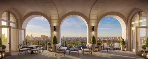 a view of roof deck with table and chairs