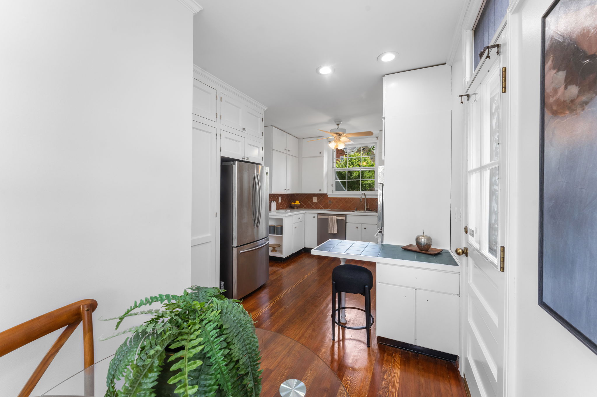 1325 Locust Road Northwest Washington, DC 20012 - Photo 22 of 56 a kitchen with a refrigerator and a stove top oven