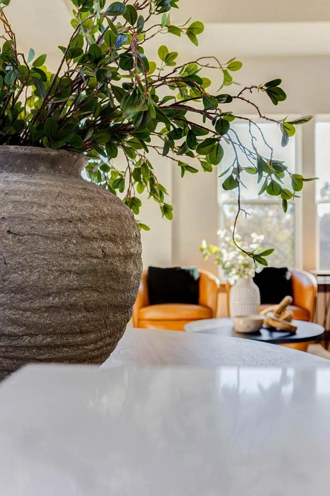 a vase of flowers sitting on a table