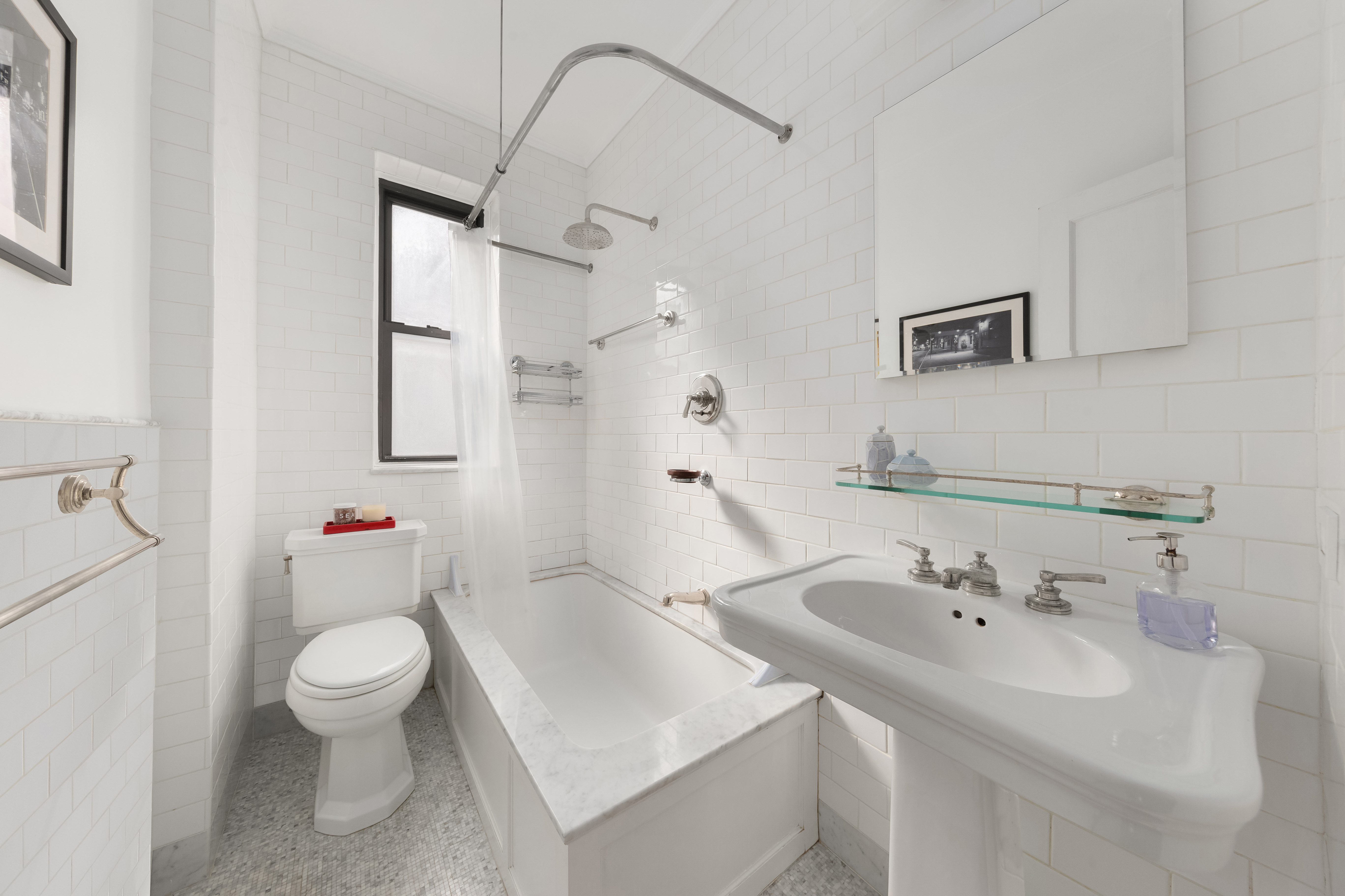 305 East 88th Street, Unit 5G Manhattan, NY 10128 - Photo 5 of 14 a bathroom with a sink toilet and shower