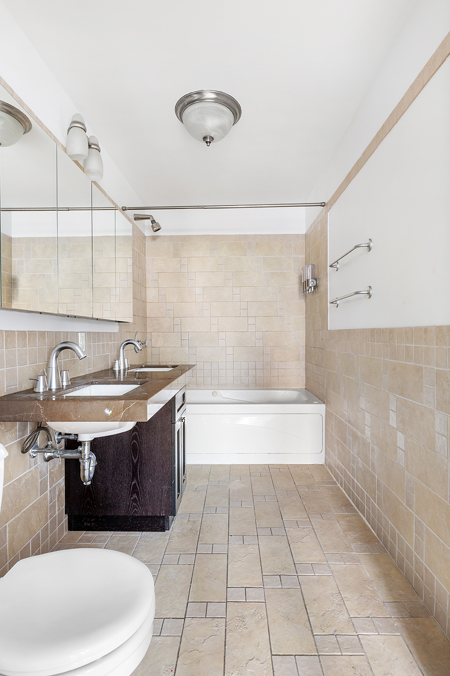 145 Park Place, Unit 3F Brooklyn, NY 11217 - Photo 5 of 9 a bathroom with a sink a toilet and bathtub