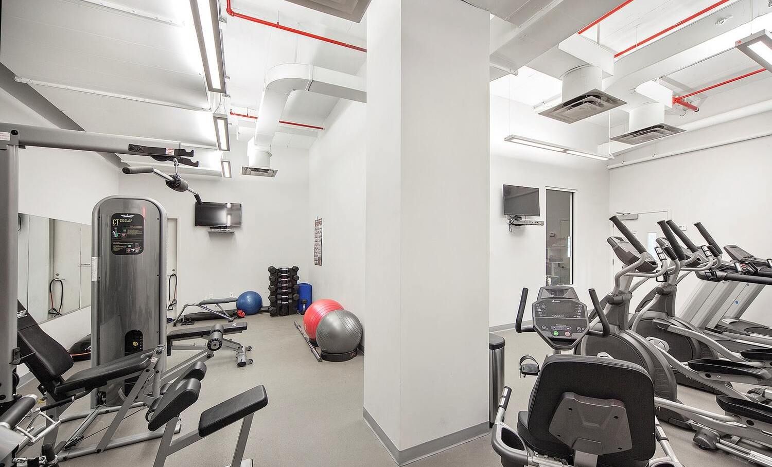 23 West 116th Street, Unit 8A Manhattan, NY 10026 - Photo 22 of 28 a view of a room with gym equipment