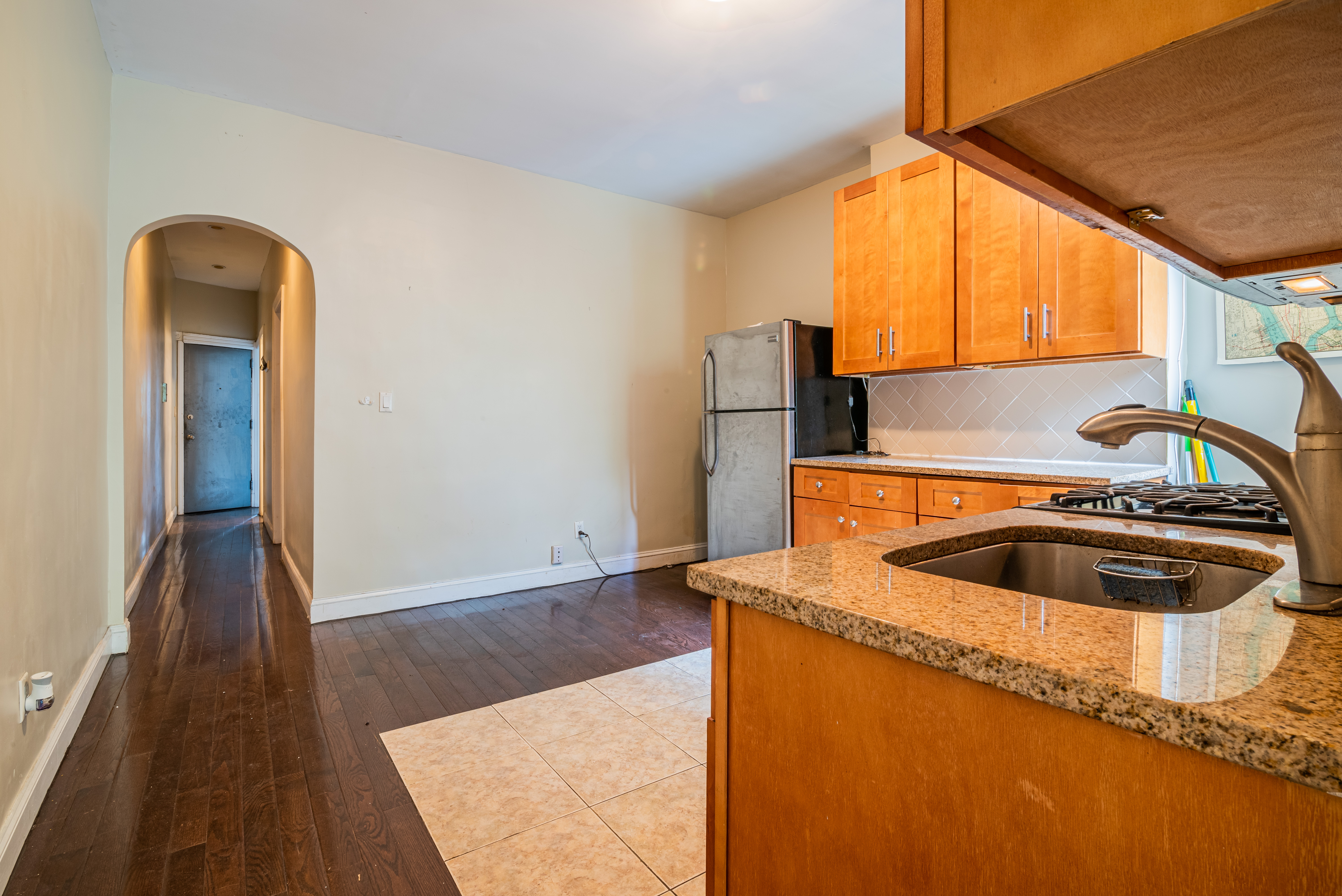 681 Sterling Place, Unit 2L Brooklyn, NY 11216 - Photo 2 of 8 a kitchen with sink cabinets and a wooden floor