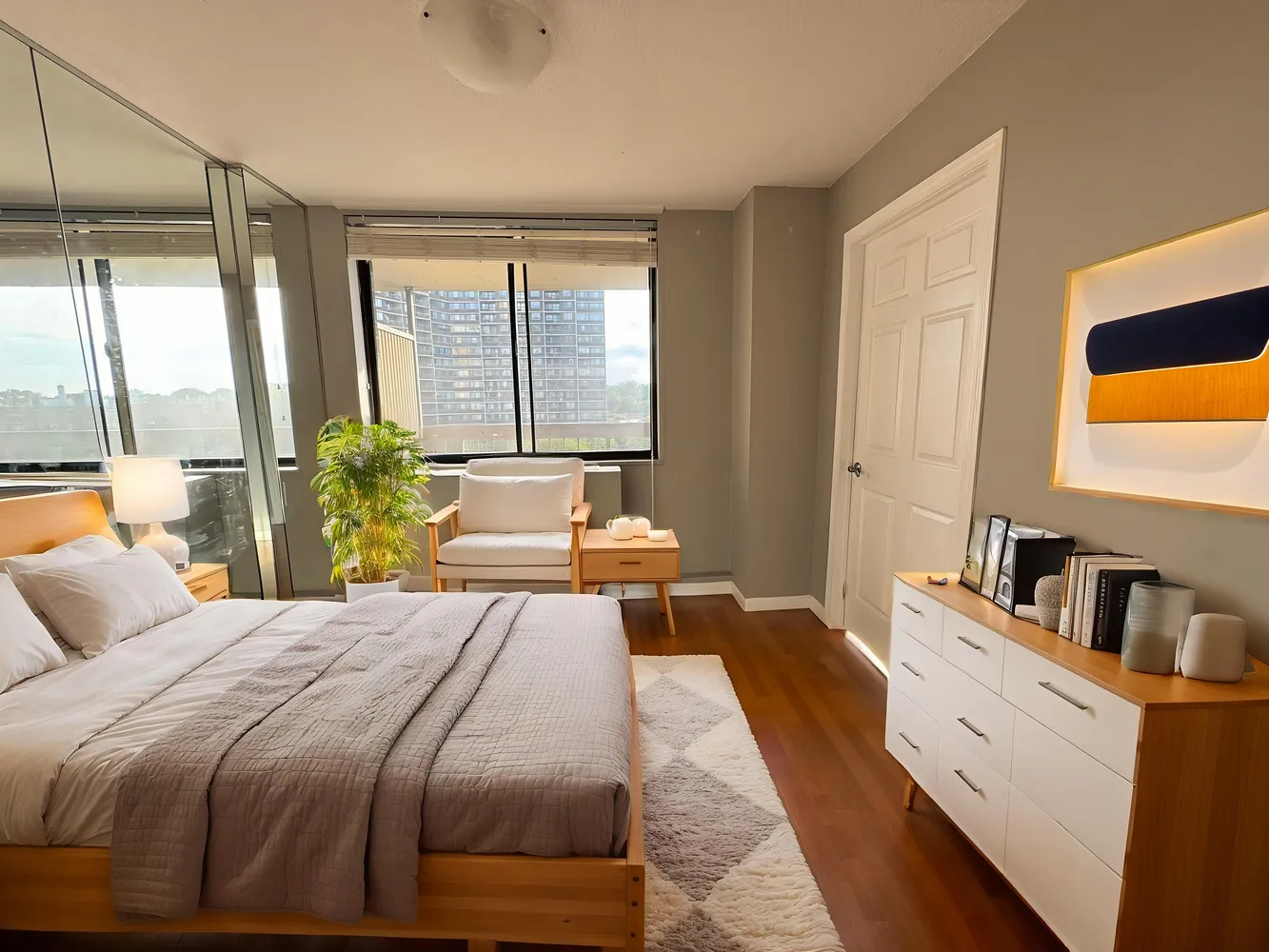 a bedroom with a large bed and a large window