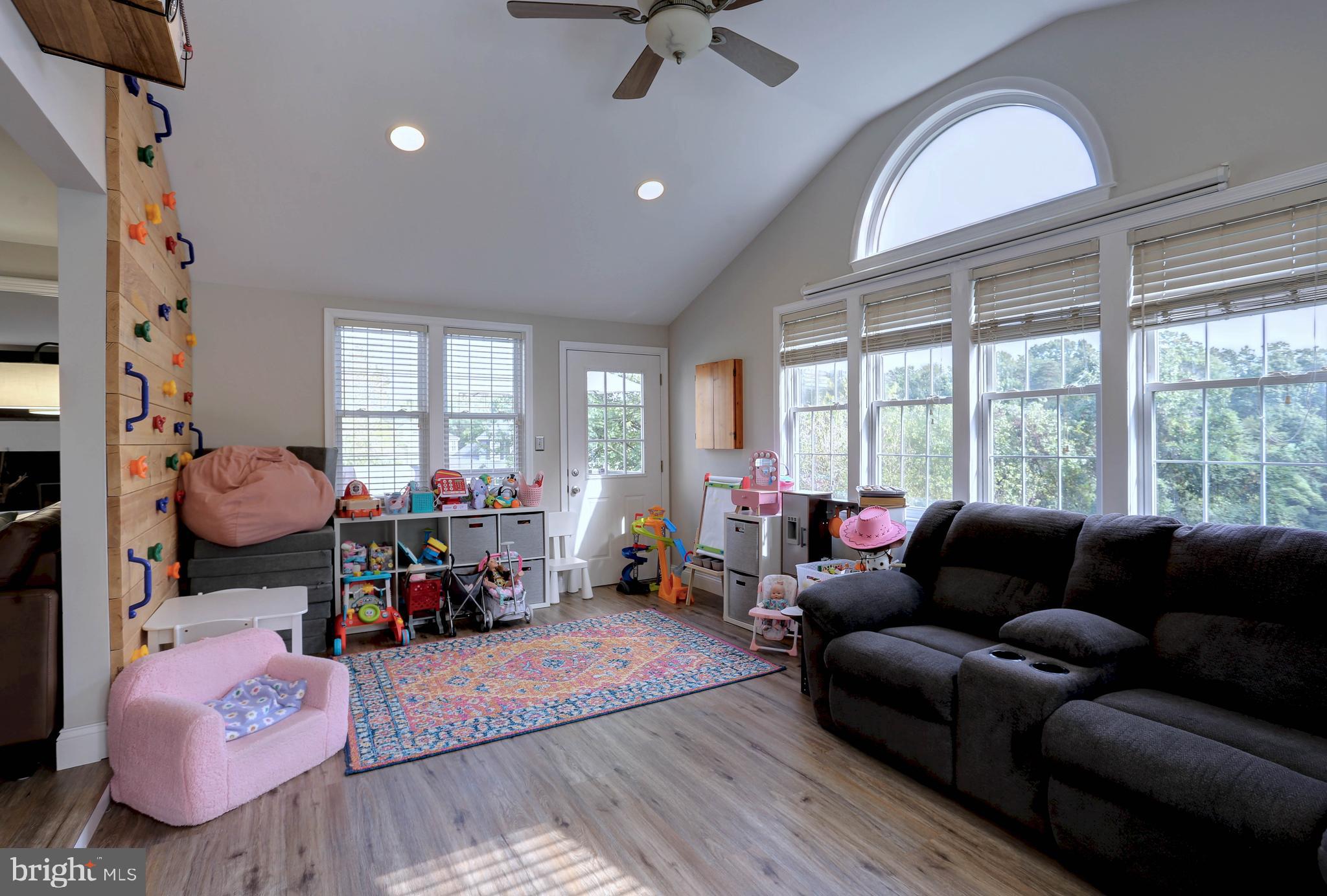 6257 Fairbourne Court Hanover, MD 21076 - Photo 18 of 47 a living room with furniture and a large window