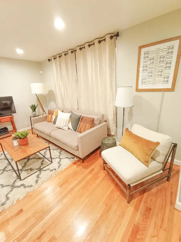 a living room with furniture and a rug