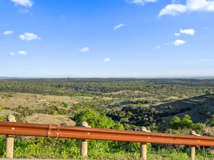 a view of a road with an ocean view