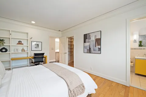 a bathroom with a toilet a sink and shower