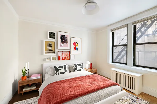 a bedroom with bed and windows