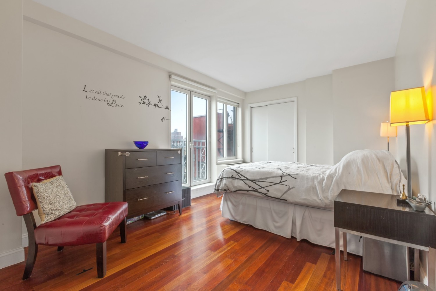 603 West 148th Street, Unit 10A Manhattan, NY 10031 - Photo 5 of 11 a bedroom with a bed and a chair