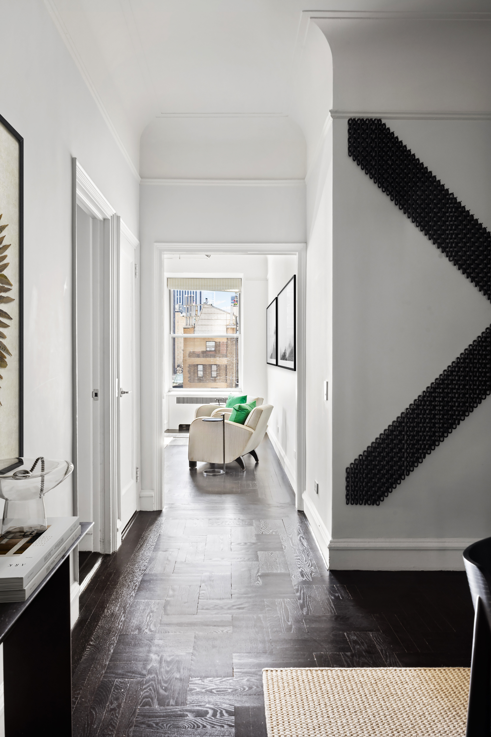 180 West 58th Street, Unit 11A Manhattan, NY 10019 - Photo 6 of 17 a living room with furniture and a table