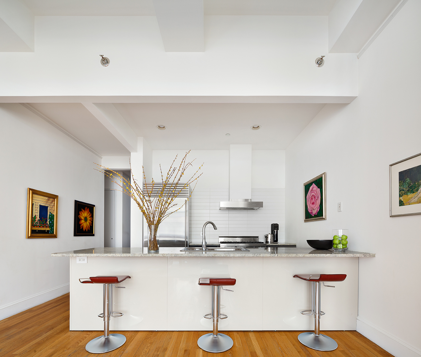 129 Lafayette Street, Unit 3B Manhattan, NY 10013 - Photo 6 of 13 a kitchen with stainless steel appliances kitchen island granite countertop a sink and cabinets