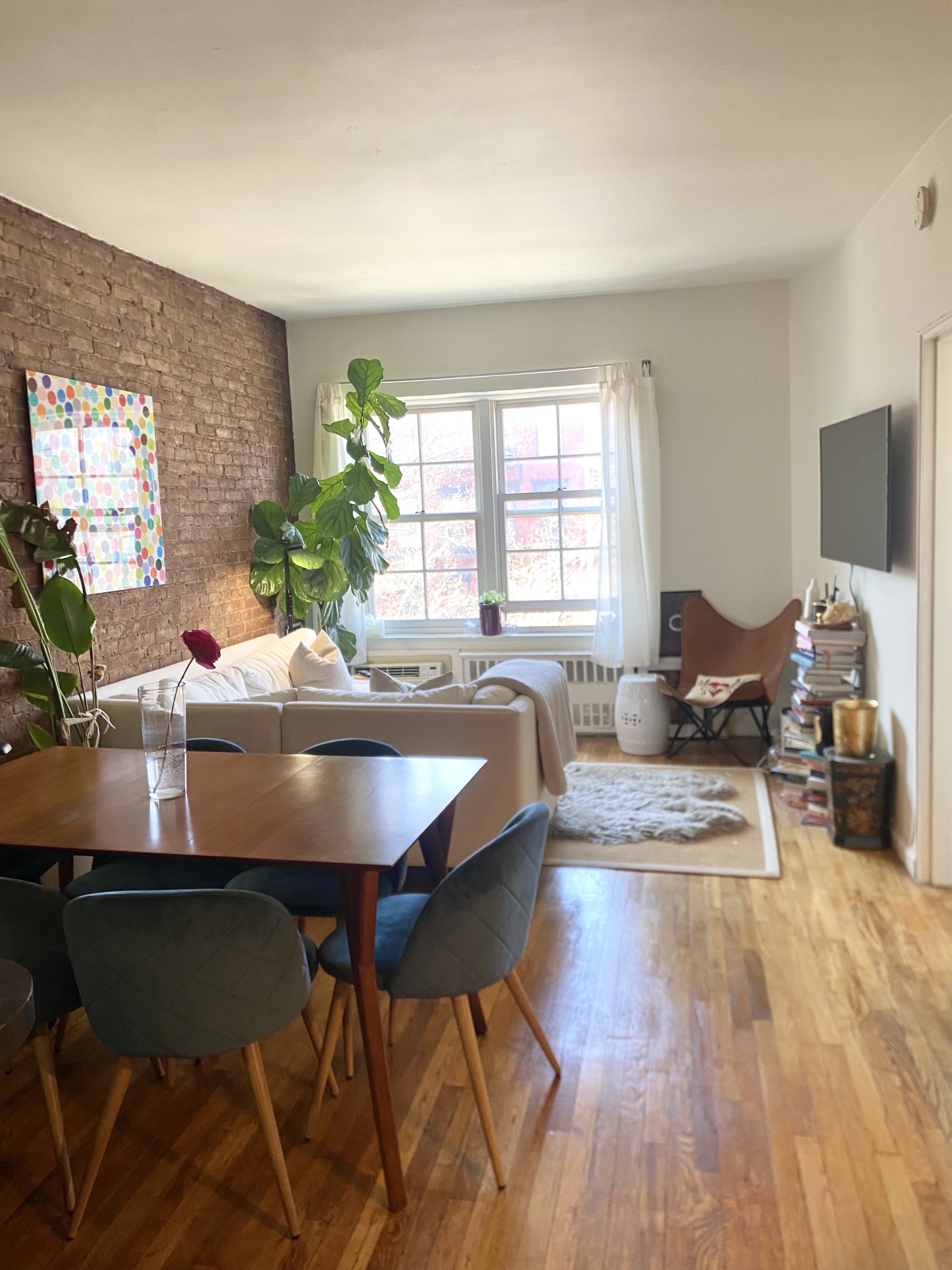 a view of a dining room with furniture and wooden floor