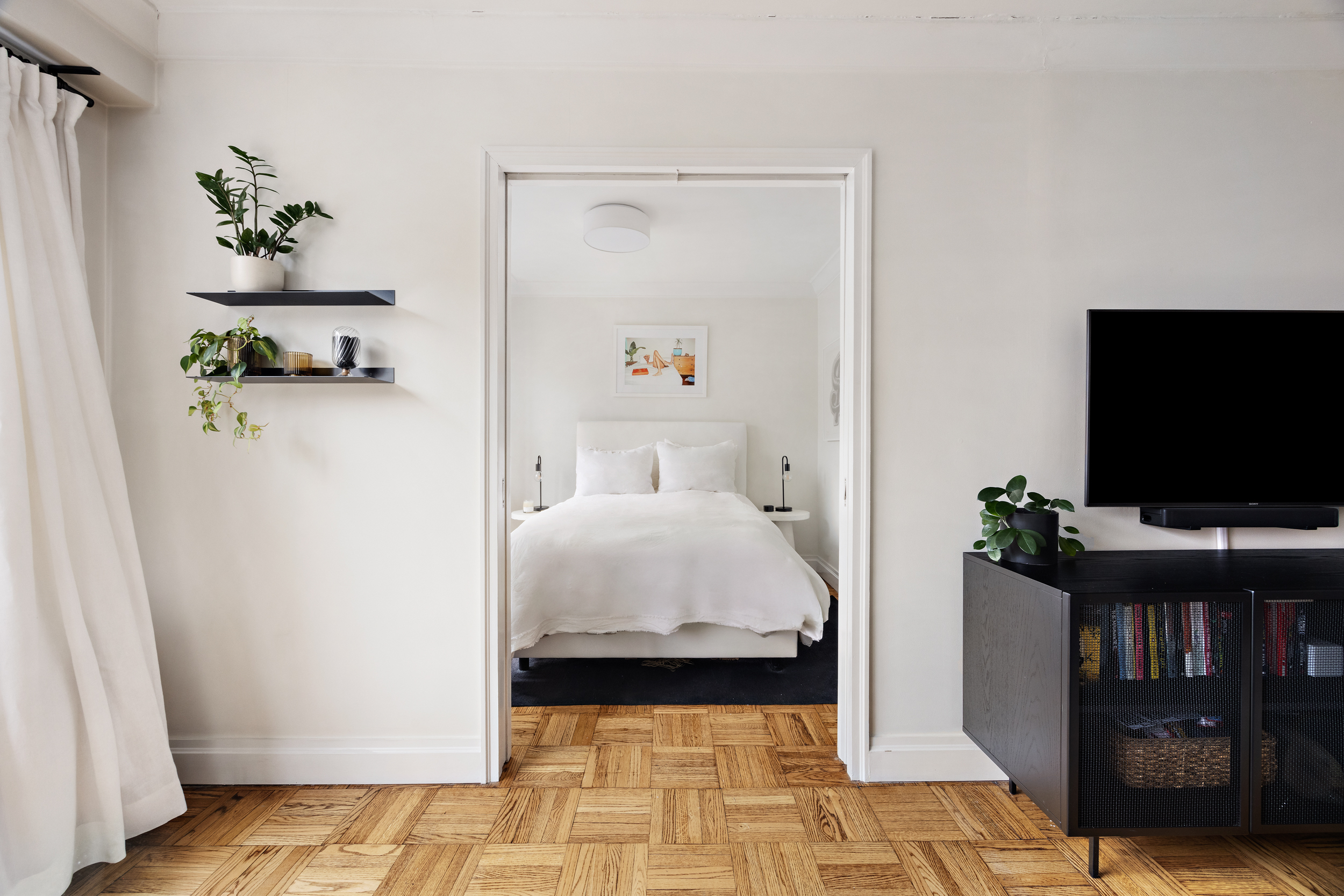 175 West 12th Street, Unit 4L Manhattan, NY 10011 - Photo 7 of 11 a bedroom with a bed and flat screen tv