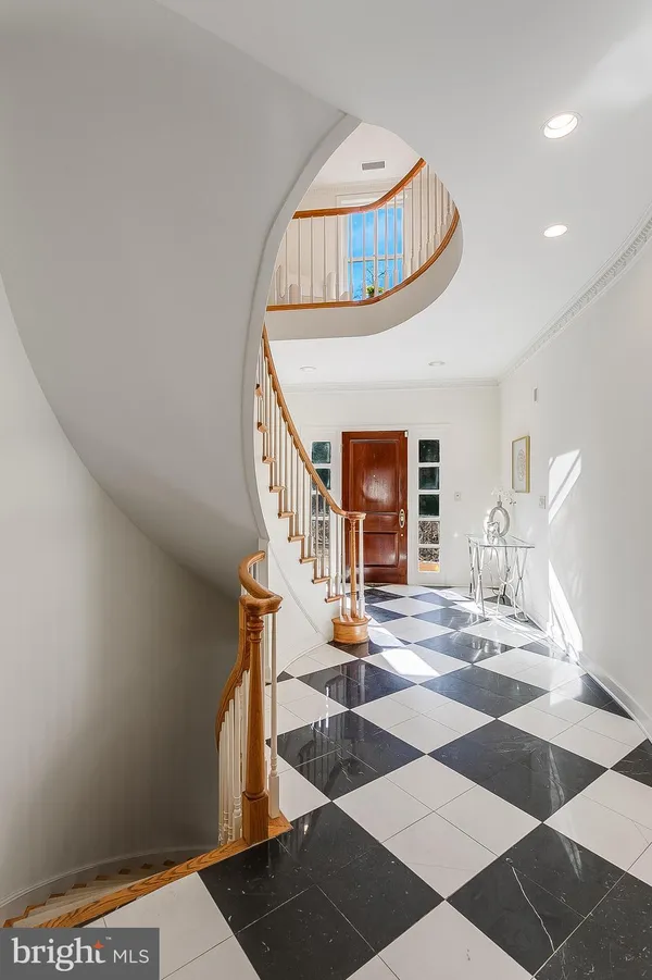 a view of an entryway with wooden floor