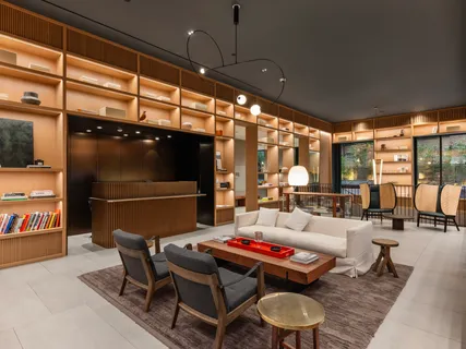 a living room with furniture and a floor to ceiling window