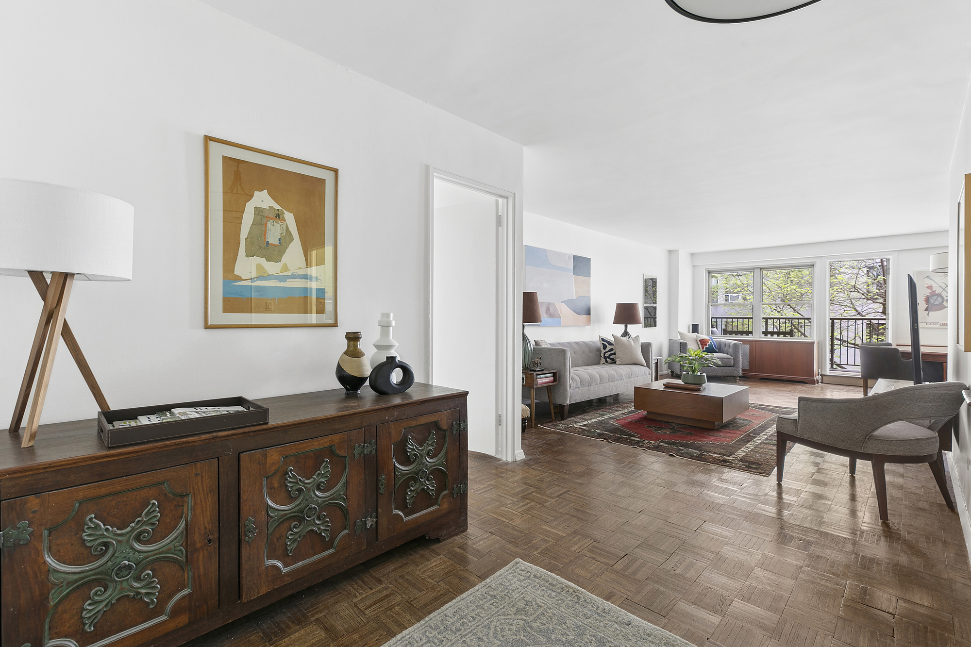 1199 Park Avenue, Unit 2F Manhattan, NY 10128 - Photo 3 of 12 a living room with furniture and a window