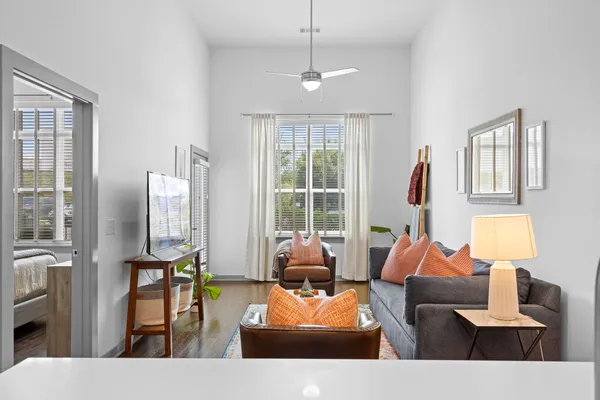 a living room with furniture and a large window