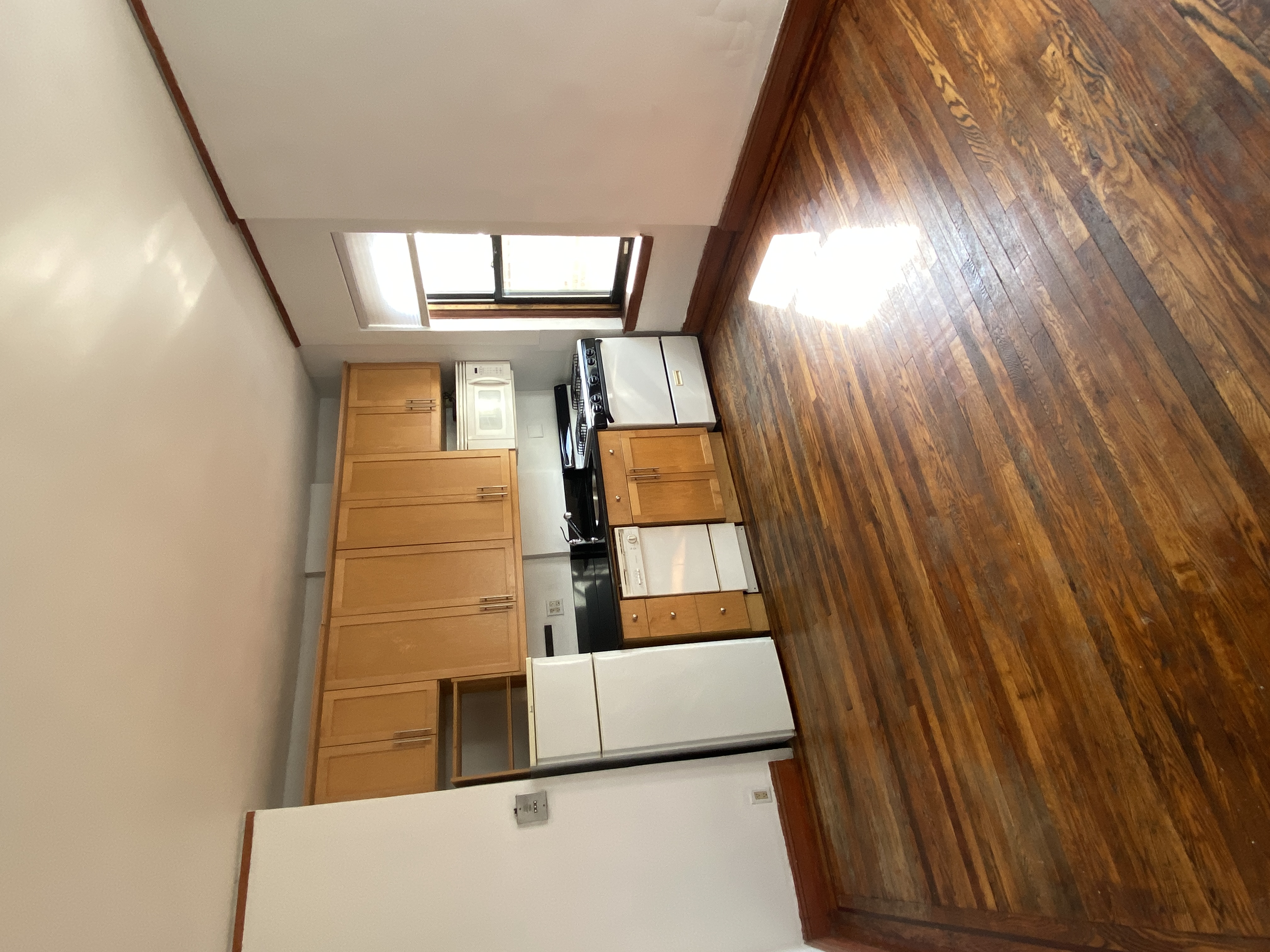 94 Hamilton Place, Unit 5E Manhattan, NY 10031 - Photo 4 of 13 a view of kitchen and wooden floor