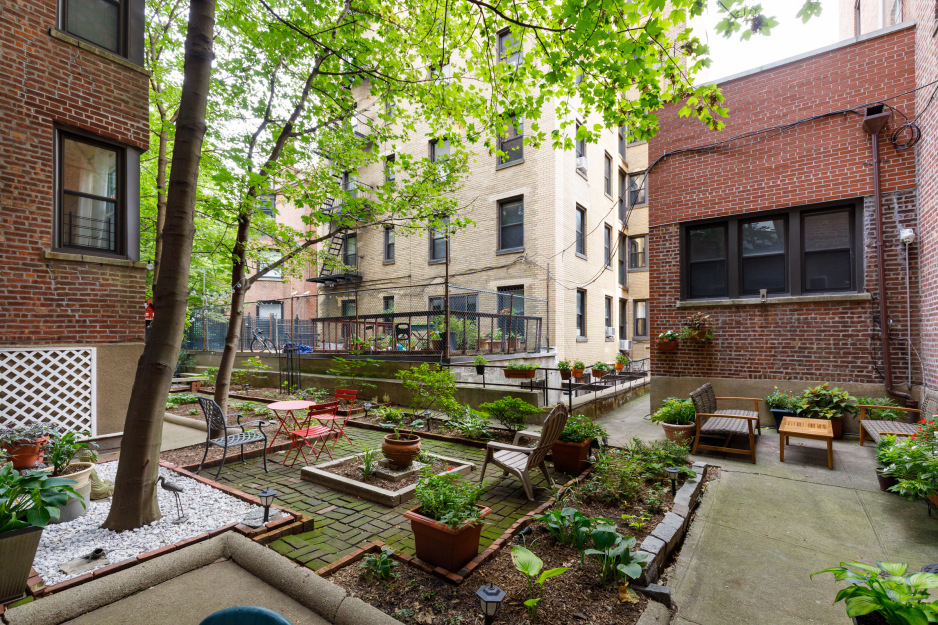 45 Plaza Street West, Unit 1F Brooklyn, NY 11217 - Photo 9 of 10 a view of a house with backyard sitting area and garden