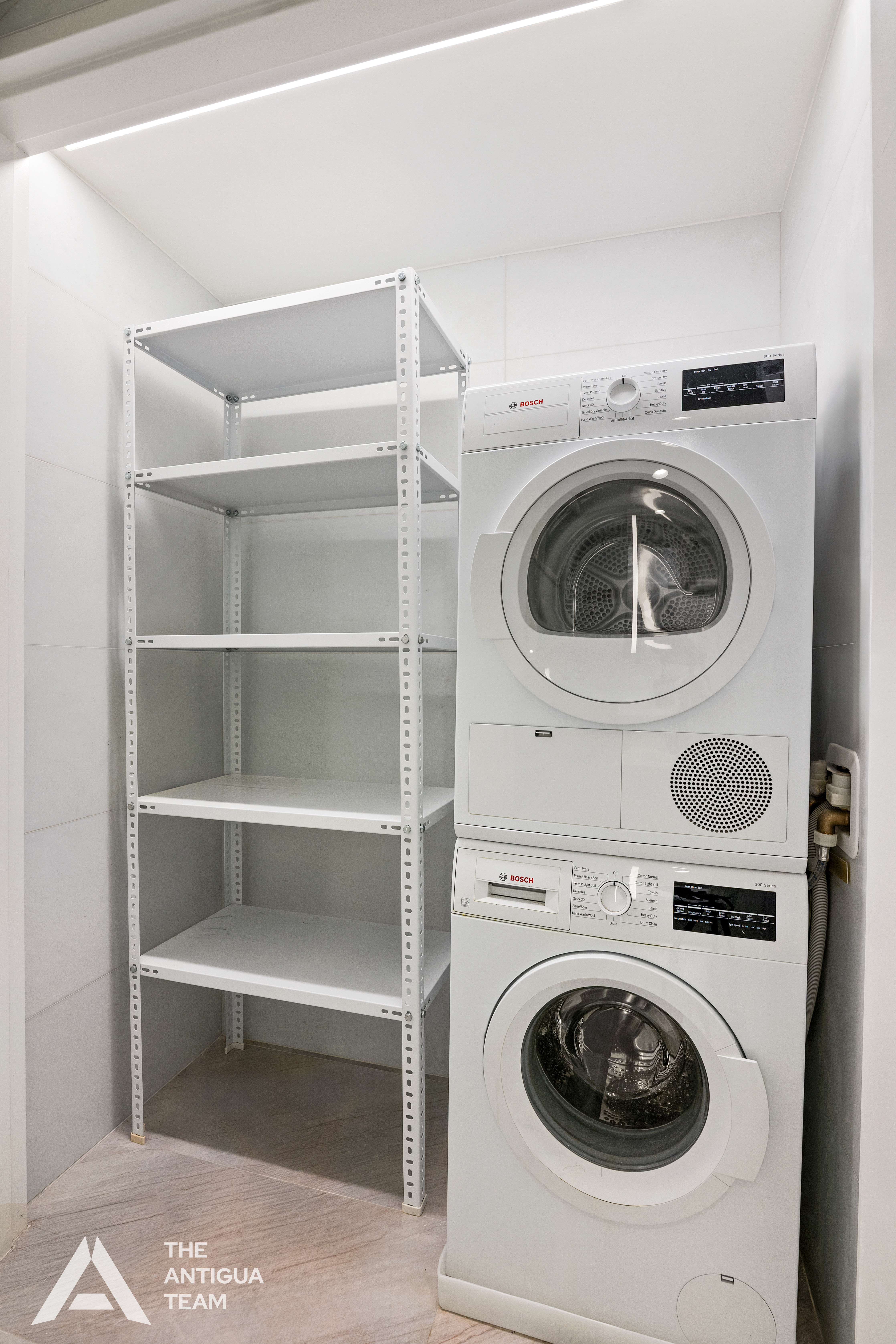 695 1st Avenue, Unit 34A Manhattan, NY 10016 - Photo 6 of 21 a utility room with dryer and washer