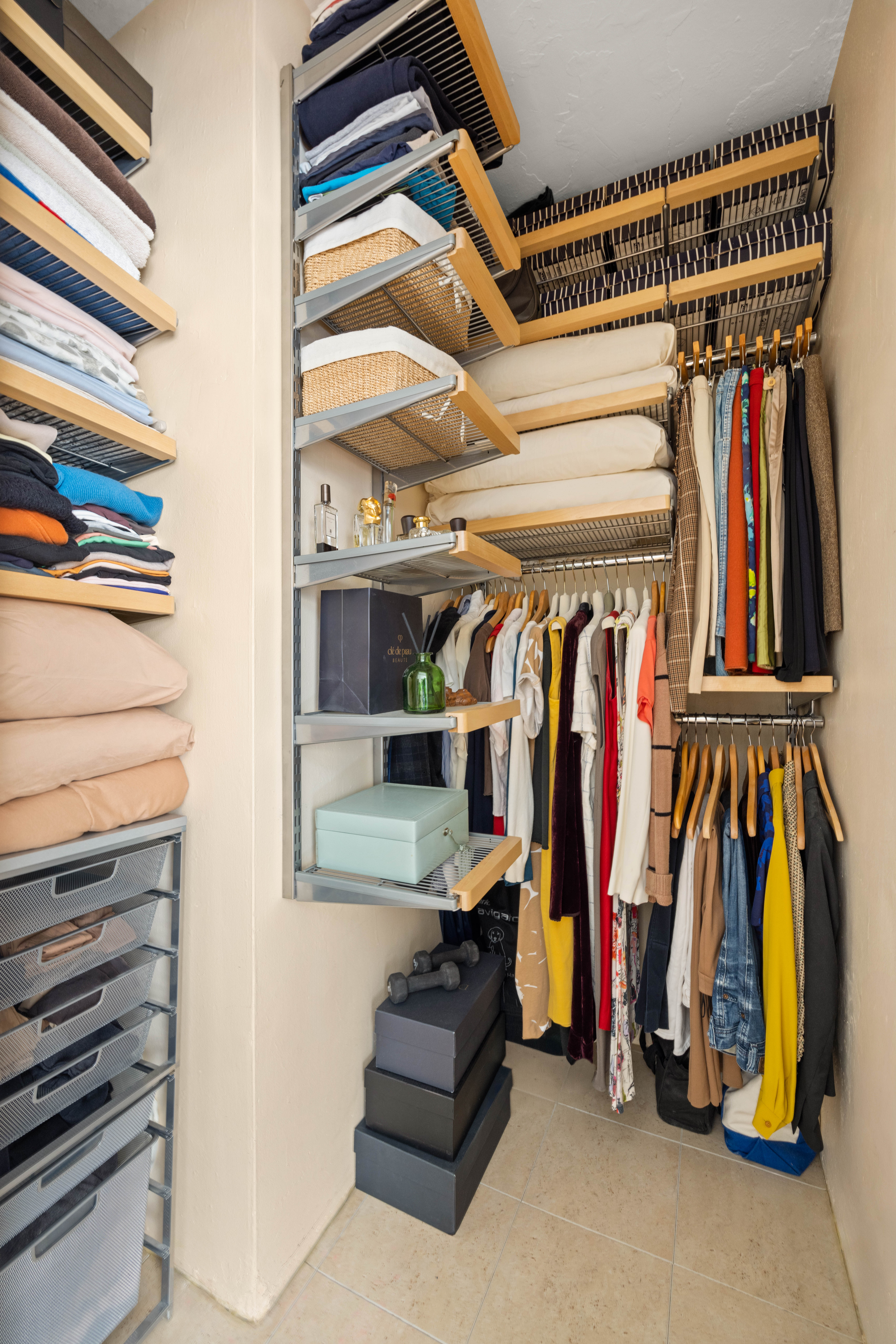 70 Remsen Street, Unit 4J Brooklyn, NY 11201 - Photo 4 of 8 a view of walk in closet with clothes and shoes