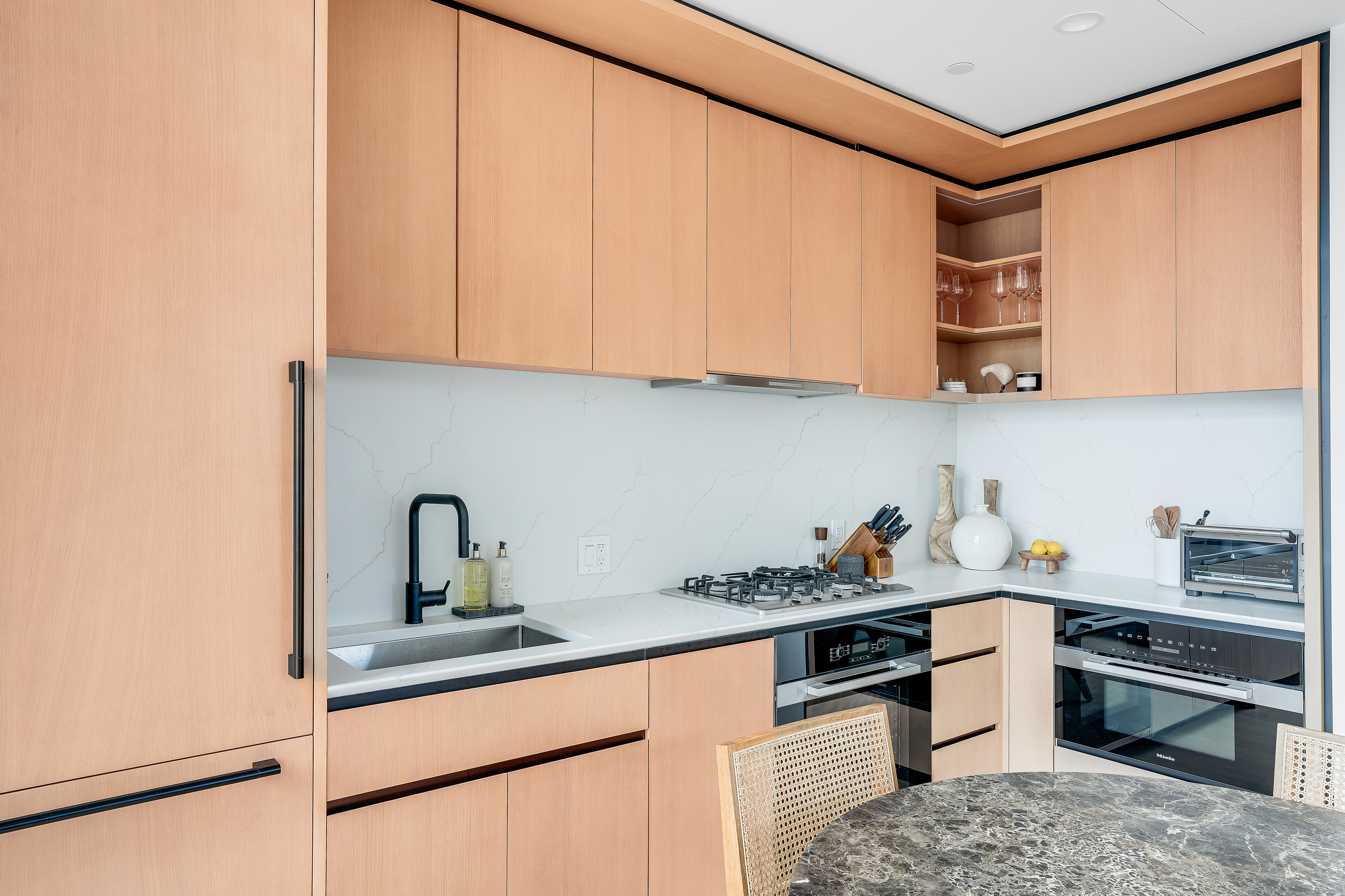 480 Kent Avenue, Unit 9A Brooklyn, NY 11249 - Photo 6 of 33 a kitchen with stainless steel appliances granite countertop a sink and cabinets
