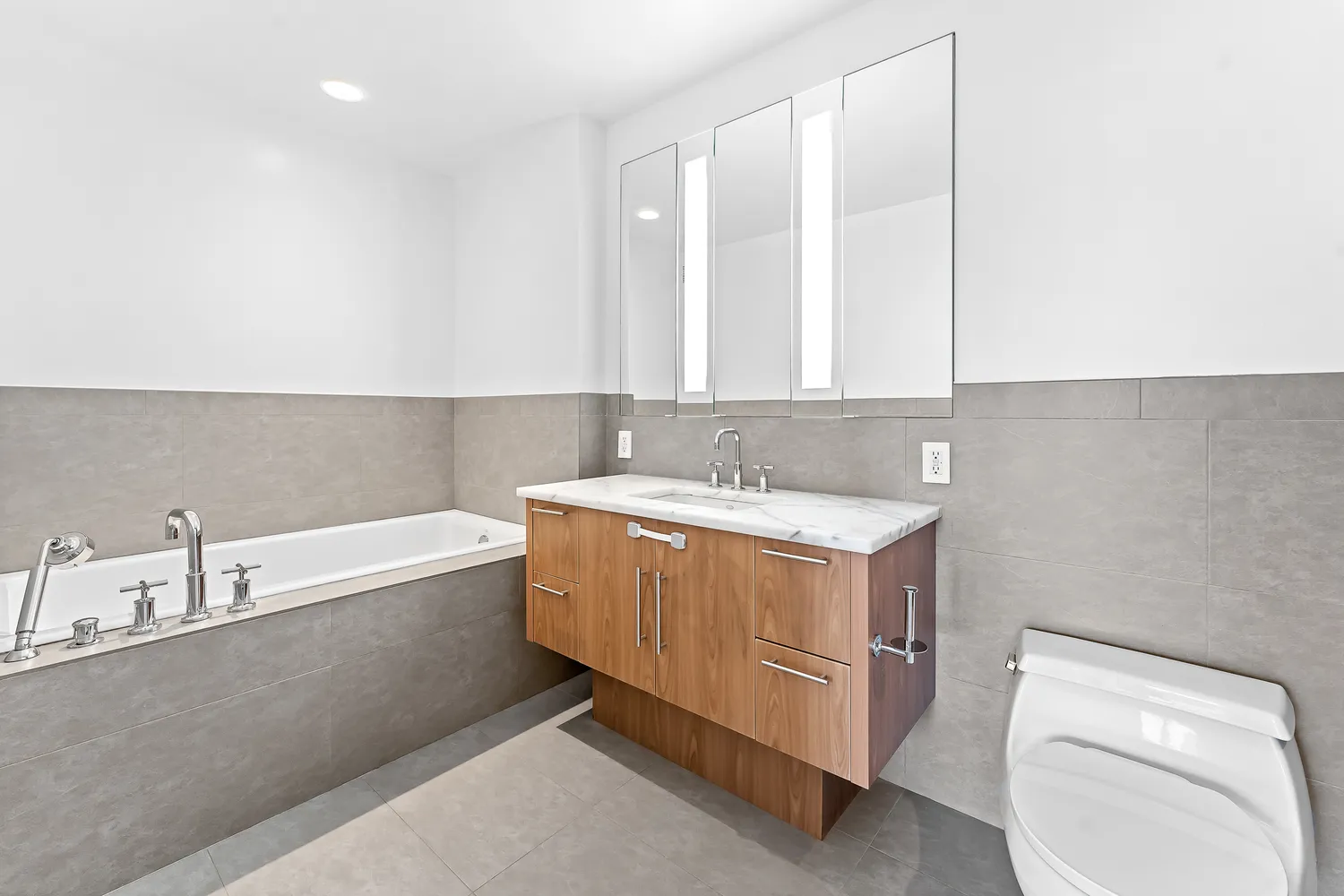 a bathroom with a bathtub sink and toilet