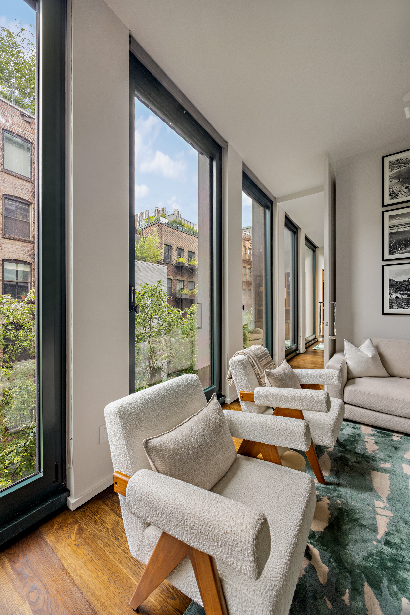40 Bond Street, Unit 6D Manhattan, NY 10012 - Photo 6 of 23 a living room with furniture and a large window