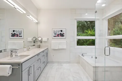 a bathroom with a bathtub and shower