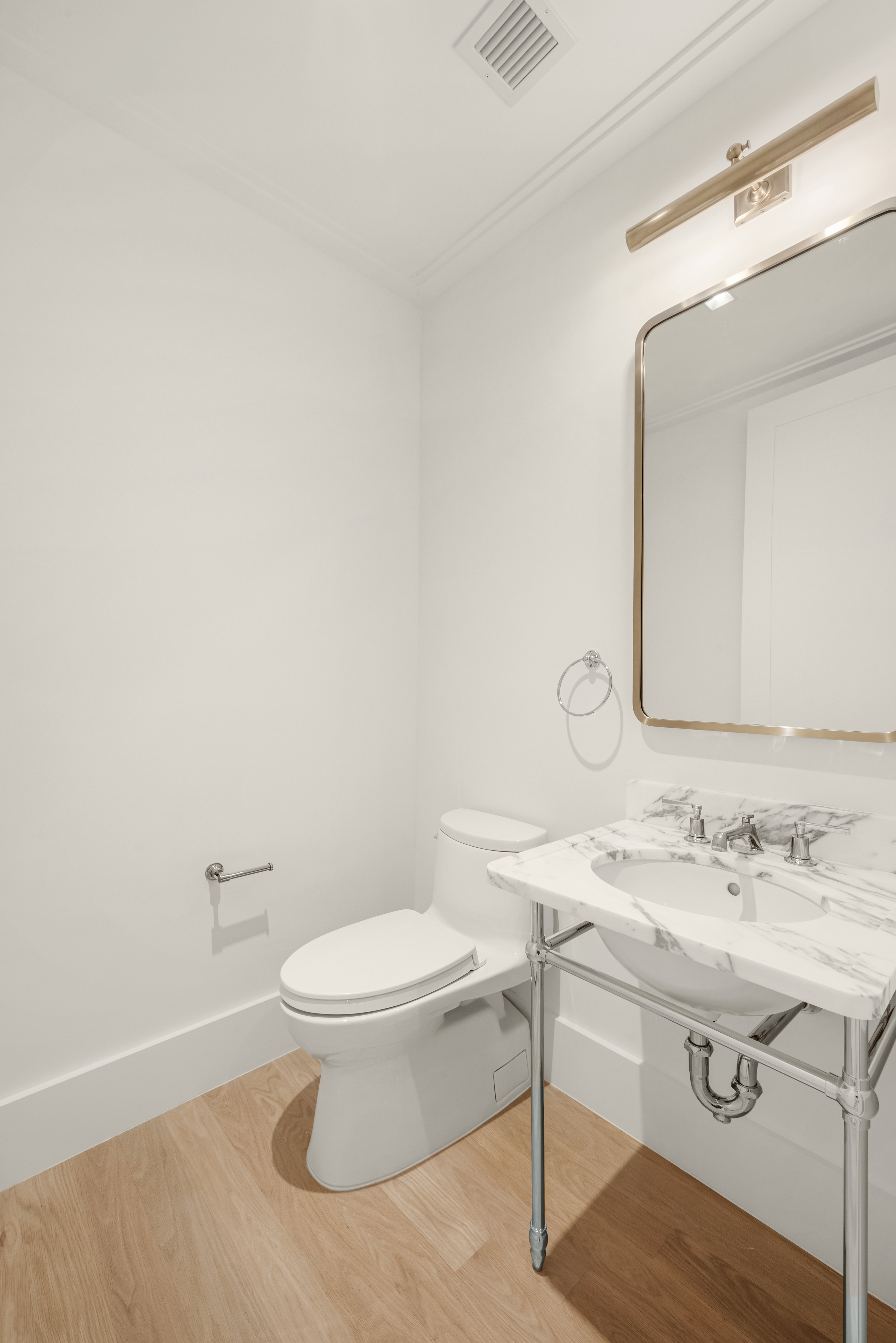 200 East 75th Street, Unit 6C Manhattan, NY 10021 - Photo 10 of 11 a bathroom with a sink a toilet and mirror