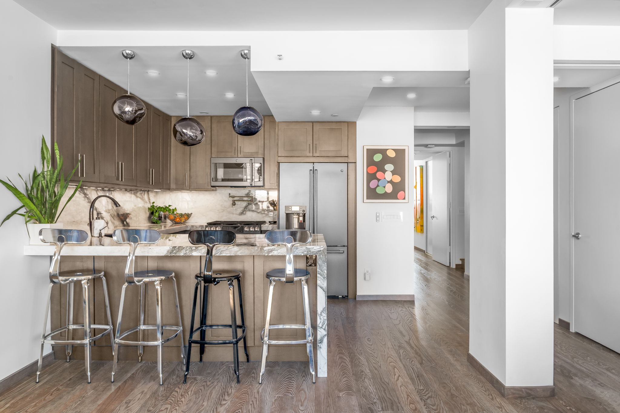 350 West 53rd Street, Unit PHB Manhattan, NY 10019 - Photo 9 of 34 a kitchen with a table and chairs in it