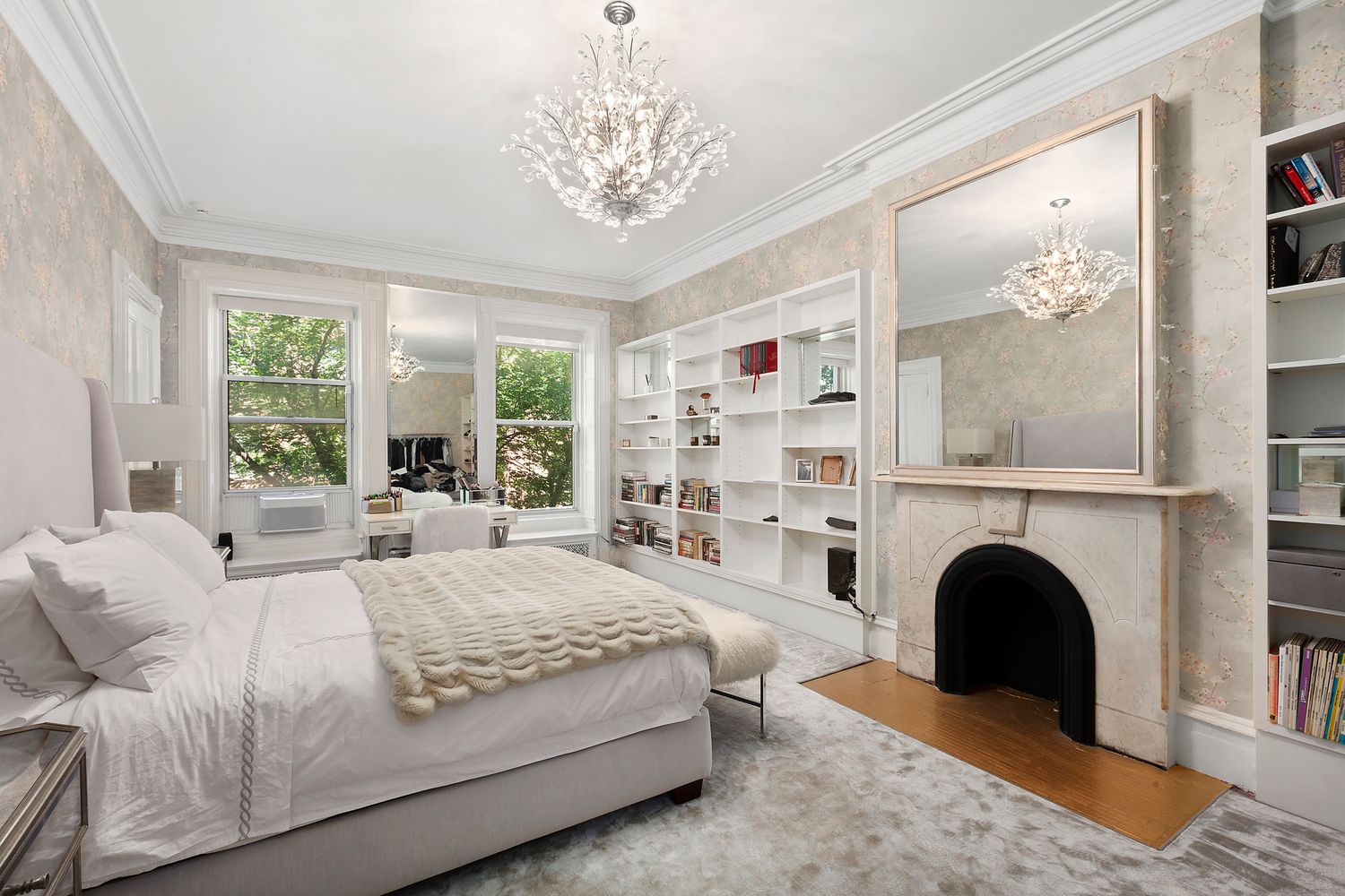 16 East 74th Street, Unit 4/5 Manhattan, NY 10021 - Photo 7 of 13 a bedroom with a large bed and a fireplace