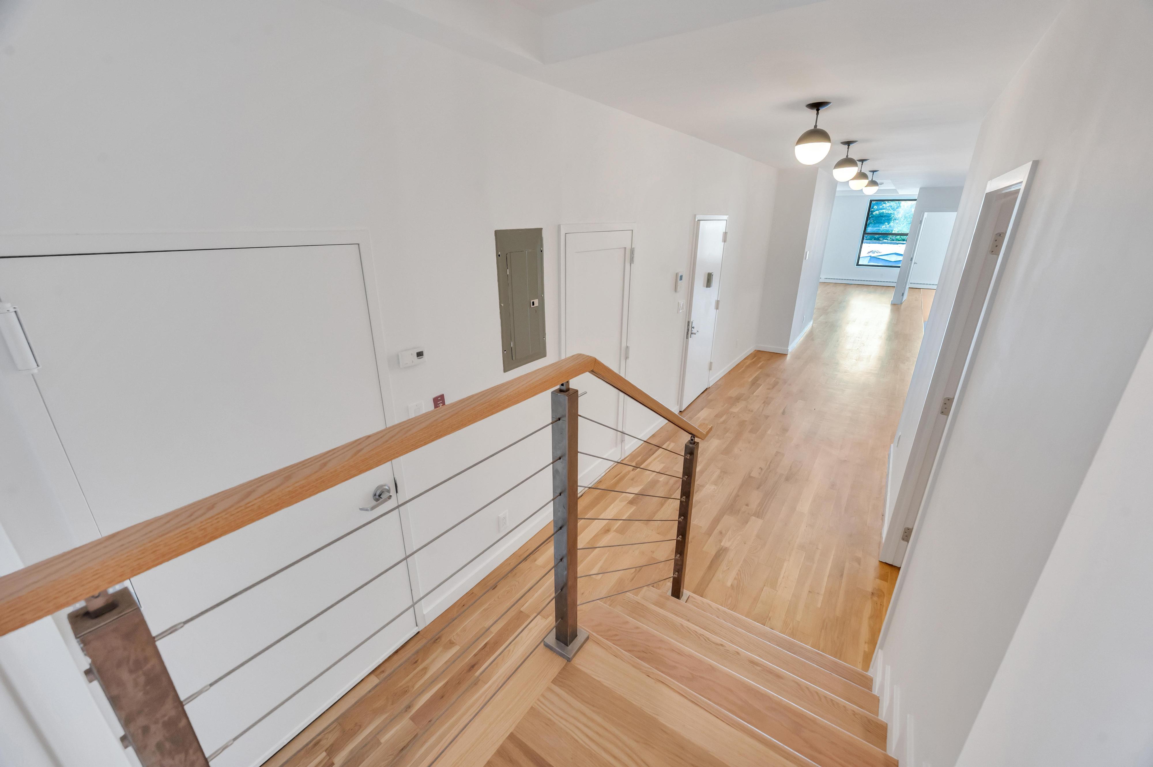 717 Manhattan Avenue, Unit 3A Brooklyn, NY 11222 - Photo 15 of 18 a view of a hallway with staircase