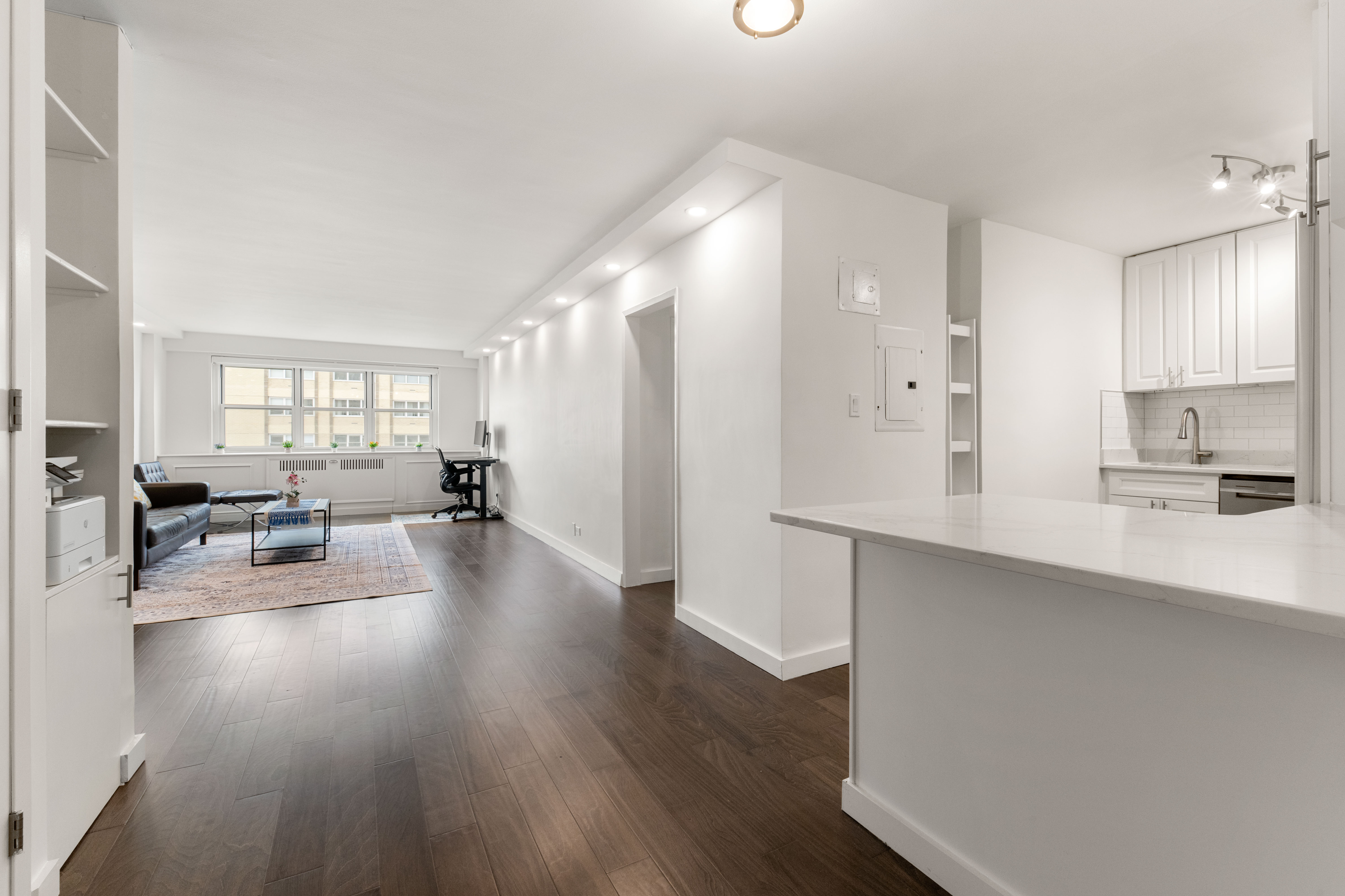66-36 Yellowstone Boulevard, Unit 24A Queens, NY 11375 - Photo 4 of 20 a living room with furniture and a wooden floor