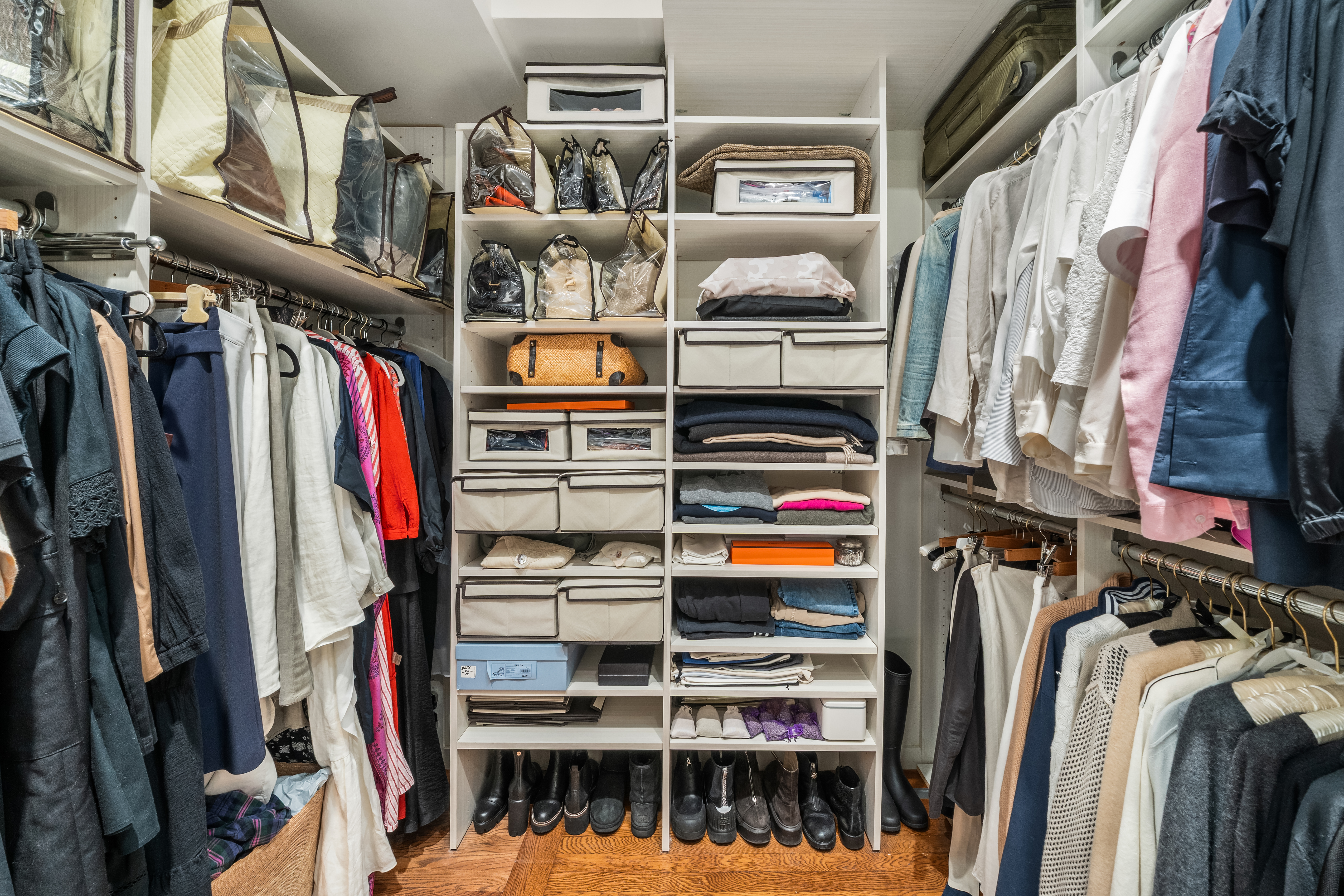 455 East 51st Street, Unit 2F Manhattan, NY 10022 - Photo 13 of 17 a view of walk in closet with clothes and shoes