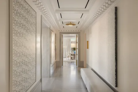 a view of hallway with wooden floor